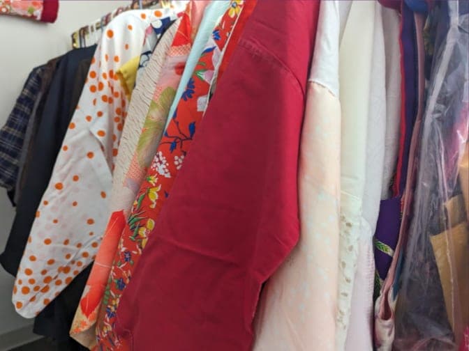 A rack of colorful kimono and haori at the All Things Japanese Sale