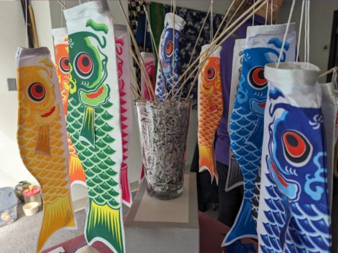 Carp streamers (koinobori) for sale, standing in a vase at the All Things Japanese Sale